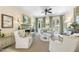 Comfortable living room with a fireplace, large windows, and elegant décor offers a warm and inviting atmosphere for relaxation at 3617 Carlow Ct, Raleigh, NC 27612
