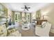 Bright living room featuring French doors, a fireplace, and stylish, comfortable furnishings at 3617 Carlow Ct, Raleigh, NC 27612