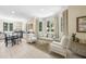 Inviting living room with large windows, comfortable seating, and an adjacent dining area at 3617 Carlow Ct, Raleigh, NC 27612