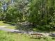 Scenic view of community park featuring mature trees and walking trails at 3617 Carlow Ct, Raleigh, NC 27612