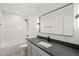 Bright bathroom with tub shower combination, white cabinets, and a modern style at 380 Pilot Ridge Rd, Zebulon, NC 27597