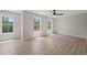Spacious bedroom with multiple windows providing plenty of natural light and ceiling fan at 380 Pilot Ridge Rd, Zebulon, NC 27597