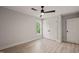 Bright bedroom features a ceiling fan, and closet with white doors at 380 Pilot Ridge Rd, Zebulon, NC 27597