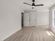 Bedroom boasts a ceiling fan, light hardwood floors, with two closets at 380 Pilot Ridge Rd, Zebulon, NC 27597