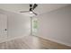 Bright bedroom features a ceiling fan, large window, and neutral paint at 380 Pilot Ridge Rd, Zebulon, NC 27597
