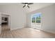 Bedroom featuring a large window with natural light and a view of the surrounding trees at 380 Pilot Ridge Rd, Zebulon, NC 27597