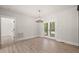 Open dining area filled with natural light featuring French doors leading to a covered porch at 380 Pilot Ridge Rd, Zebulon, NC 27597