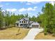 Beautiful two story home with a long driveway and lush, mature landscaping at 380 Pilot Ridge Rd, Zebulon, NC 27597