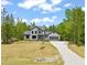 Charming two-story home featuring a manicured lawn, inviting driveway, and attached two-car garage at 380 Pilot Ridge Rd, Zebulon, NC 27597