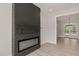 Living room showcasing a modern black brick fireplace and an open floor plan at 380 Pilot Ridge Rd, Zebulon, NC 27597