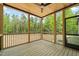 The screened porch has wood floors and ceiling, ideal for enjoying nature at 380 Pilot Ridge Rd, Zebulon, NC 27597