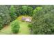 An aerial view of the beautiful home surrounded by lush greenery and mature trees at 4006 Daniel Rd, Durham, NC 27703
