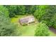 An aerial view of the house with lush surroundings on a private lot at 4006 Daniel Rd, Durham, NC 27703