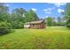 Backyard shot of home with mature tree coverage at 4006 Daniel Rd, Durham, NC 27703