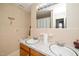 Bathroom with double sinks and patterned wallpaper at 4006 Daniel Rd, Durham, NC 27703