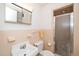 Bathroom with white sink, toilet, shower, and neutral tile at 4006 Daniel Rd, Durham, NC 27703