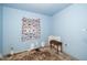 Bedroom with blue walls and aged flooring at 4006 Daniel Rd, Durham, NC 27703