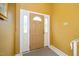 Warm and welcoming foyer featuring a neutral-colored door with decorative sidelights and a classic design at 4006 Daniel Rd, Durham, NC 27703