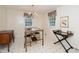 Eat-in kitchen area with windows, chandelier, and patterned floor at 4006 Daniel Rd, Durham, NC 27703
