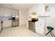 Spacious kitchen featuring white cabinetry, stainless steel appliances, and stainless refrigerator at 4006 Daniel Rd, Durham, NC 27703