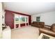 Inviting living room with a cozy leather sofa, carpeted floors, and large windows offering ample natural light at 4006 Daniel Rd, Durham, NC 27703