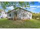 Backyard with a cozy home and green grass lawn at 407 Collier St, Smithfield, NC 27577