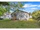Backyard with a cozy home and green grass lawn at 407 Collier St, Smithfield, NC 27577