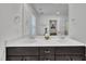 Bright bathroom featuring a double vanity with sleek, dark cabinets and modern fixtures at 407 Collier St, Smithfield, NC 27577