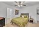 Bedroom boasts ceiling fan, warm lighting, and artistic accents for a cozy atmosphere at 407 Collier St, Smithfield, NC 27577