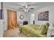 This cozy bedroom features a ceiling fan, decorative furniture, and a calming atmosphere at 407 Collier St, Smithfield, NC 27577