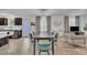 Open-concept living and dining area with modern decor, light wood floors, and ample natural light at 407 Collier St, Smithfield, NC 27577