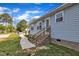 Charming home with a side entry, well-maintained lawn, and inviting walkway at 407 Collier St, Smithfield, NC 27577