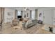 Open-concept living room featuring modern furnishings, light wood floors, and plenty of natural light at 407 Collier St, Smithfield, NC 27577