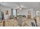 Bright living room featuring hardwood flooring, neutral paint, modern furniture, and recessed lighting at 407 Collier St, Smithfield, NC 27577