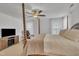 This bright main bedroom features a four poster bed, soft carpeting, and a TV entertainment center at 407 Collier St, Smithfield, NC 27577
