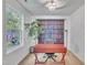 Bright office space with large windows, wood desk, and bookshelf wallpaper at 407 Collier St, Smithfield, NC 27577
