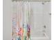 Clean, white shower stall with modern showerhead and decorative floral shower curtain at 407 Collier St, Smithfield, NC 27577