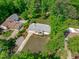 An aerial view of a two-story home showcasing its mature landscaping and neighborhood at 4109 Huckleberry Dr, Raleigh, NC 27612