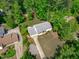Aerial view showing home and fenced in yard, deck, and lush surroundings at 4109 Huckleberry Dr, Raleigh, NC 27612