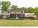 The exterior rear of the home has a screened porch and a deck at 4109 Huckleberry Dr, Raleigh, NC 27612