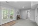 Finished basement area features French doors to outside, a walk-in storage closet and doorway at 4109 Huckleberry Dr, Raleigh, NC 27612