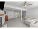 Open basement area with French doors leading to the backyard and comfortable seating area at 4109 Huckleberry Dr, Raleigh, NC 27612