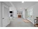Spacious finished basement area with carpeted floors, a fireplace, and doors leading to the outside at 4109 Huckleberry Dr, Raleigh, NC 27612