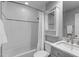 Bathroom with combination shower/tub, a mirror, and white tiling around the shower, mirror and in the background at 4109 Huckleberry Dr, Raleigh, NC 27612