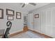 Bedroom featuring hardwood floors, closet, a door that leads to another room, and certificates hung on the wall at 4109 Huckleberry Dr, Raleigh, NC 27612