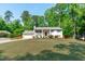 Inviting two-story home with a lush front yard, offering classic design and curb appeal at 4109 Huckleberry Dr, Raleigh, NC 27612