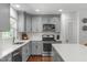 Well-equipped kitchen with stainless steel appliances and ample countertop space at 4109 Huckleberry Dr, Raleigh, NC 27612