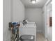 Practical laundry room with modern machines, neutral walls, and tile flooring at 4109 Huckleberry Dr, Raleigh, NC 27612