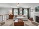Comfortable living room featuring a classic fireplace, hardwood floors, and elegant decor at 4109 Huckleberry Dr, Raleigh, NC 27612