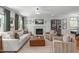 Spacious living room with fireplace, large windows, and elegant decor for comfortable living at 4109 Huckleberry Dr, Raleigh, NC 27612